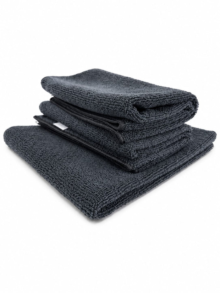 Bayetas de microfibra negras ECOPRODETAIL para detailing y limpieza del coche, dobladas y apiladas